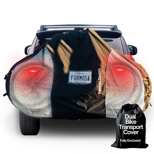 Dual bike rack cover for transport, fits 1-2 bicycles, translucent ends, includes license plate holder, protects from weather and debris.