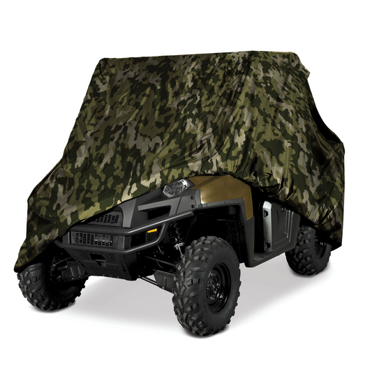 A heavy-duty, UV-treated Formosa Covers UTV Cover - Large Camouflage 120" L x 62" W x 75"H is draped over an all-terrain vehicle, partially revealing its front and large rugged tires. The background is white, highlighting the vehicle and its water-repellent cover.
