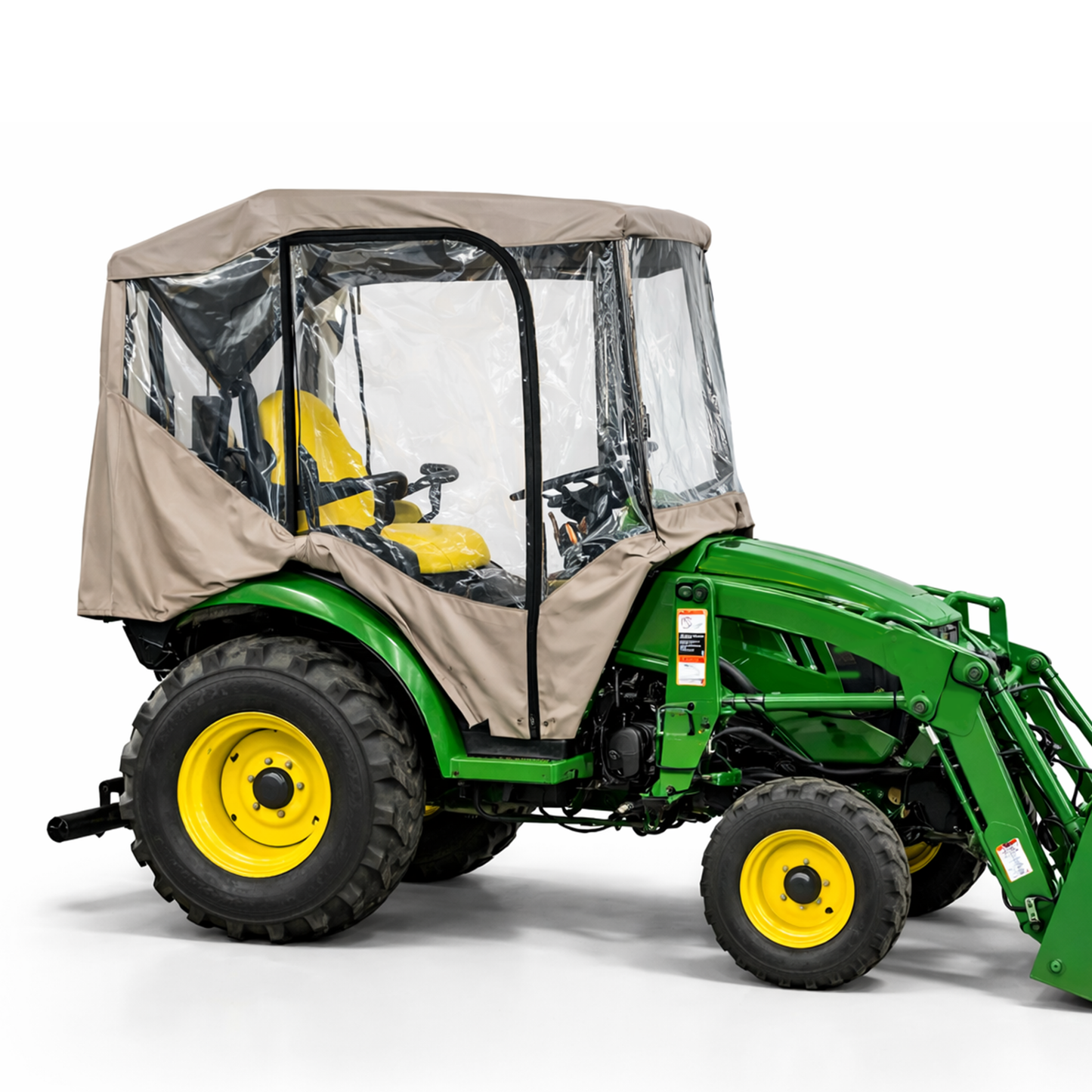 Tractor with beige weather-resistant tractor enclosure cab featuring clear PVC windows for rain, wind, and cold protection