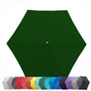 A fully open 9ft Market Patio Umbrella 6 Rib Replacement Canopy in Forest Green by Formosa Covers is displayed. Underneath it, a collection of smaller umbrellas in numerous colors, including white, gray, red, orange, yellow, light blue, teal, dark blue, purple, and black are arranged.