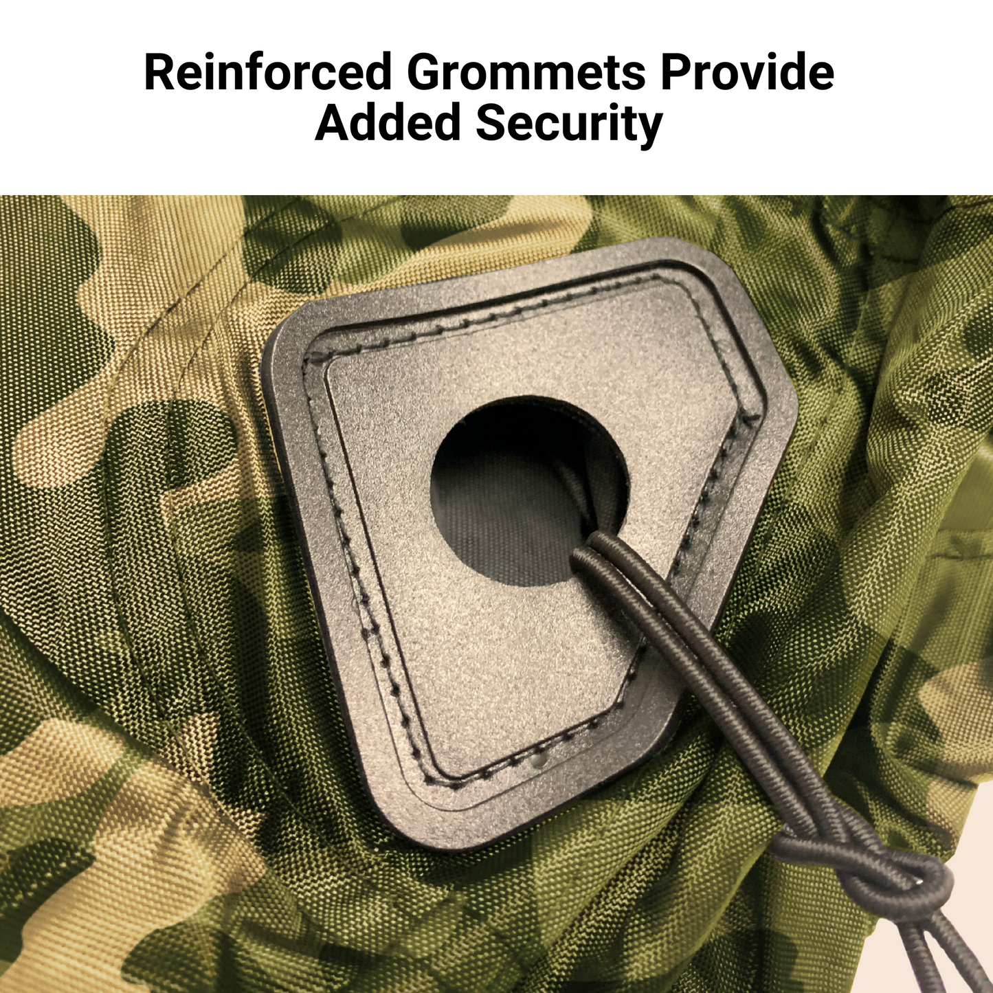 A close-up of a reinforced grommet on the Formosa Covers UTV Cover - Large Camouflage 120" L x 62" W x 75"H, showcasing a black cord threaded through durable green camo fabric. The text above reads, "Reinforced Grommets Provide Added Security." Ideal for UTV covers and made from heavy-duty UV-treated, water-repellent material.