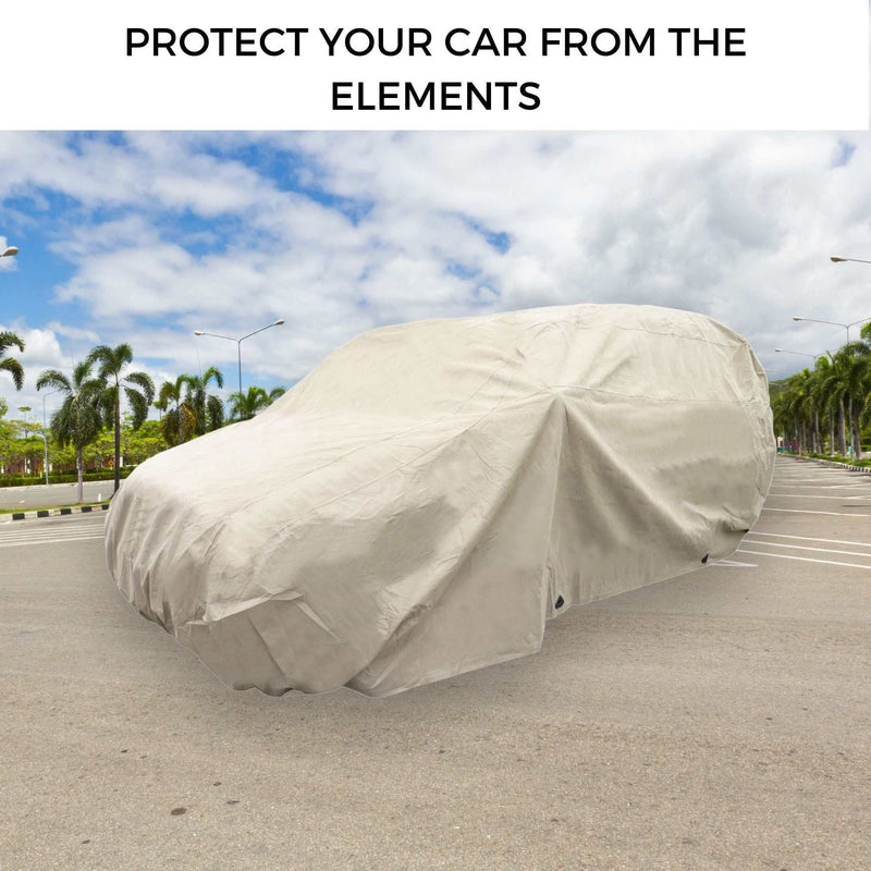 An SUV is parked outdoors and completely shielded with a beige heavy-duty cover from Formosa Covers. The background reveals a partly cloudy sky, palm trees, and an empty parking lot. The text at the top of the image reads, "PROTECT YOUR CAR FROM THE ELEMENTS," highlighting the SUV Cover Large 200"L.