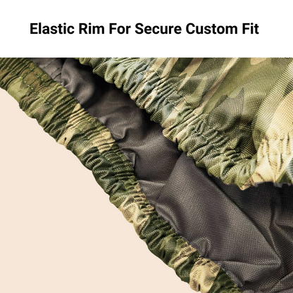 Close-up view of the UTV Cover - Large Camouflage 120" L x 62" W x 75"H from Formosa Covers, showcasing a detailed fabric with a camouflage pattern and an elastic rim labeled "Elastic Rim For Secure Custom Fit." The heavy-duty, UV-treated material is water repellent, ensuring a snug fit with its elastic edge.