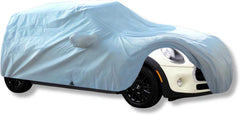 A Mini Cooper, clad in a Formosa Covers car cover designed for the Hardtop 2 Door and 4 Door, Convertible, and Coupe models up to 158