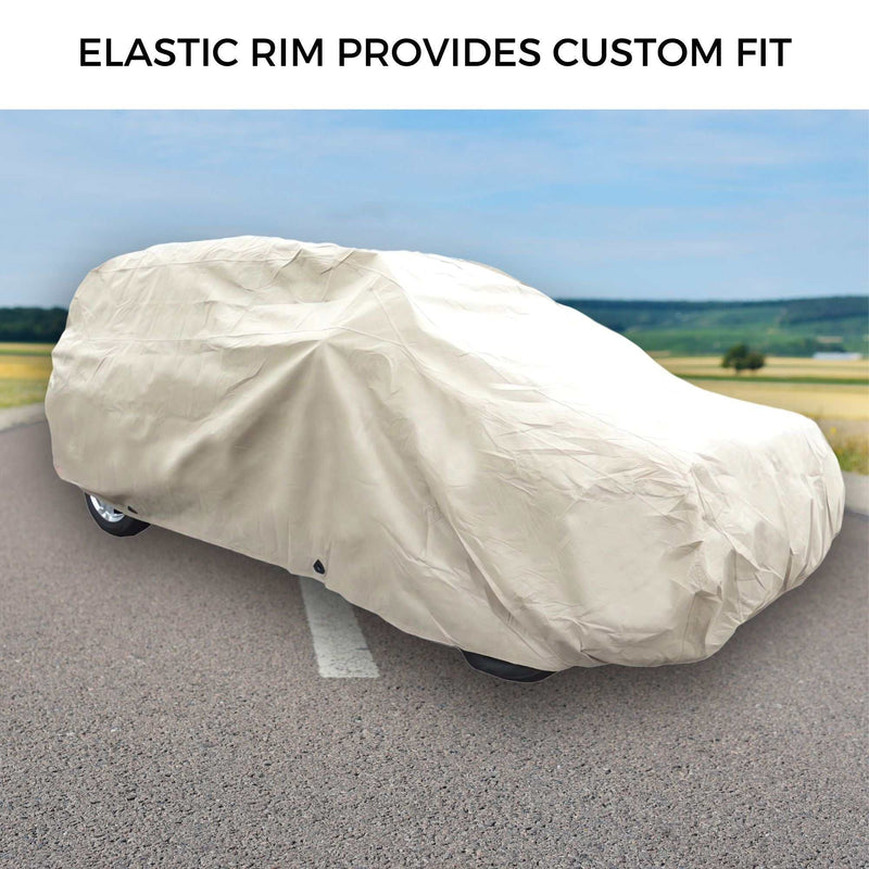 An SUV is fully covered with a beige Formosa Covers SUV Cover Large 200"L for optimal protection, parked on a paved road with grassy fields and a blue sky in the background. "ELASTIC RIM PROVIDES CUSTOM FIT" is displayed at the top of the image.