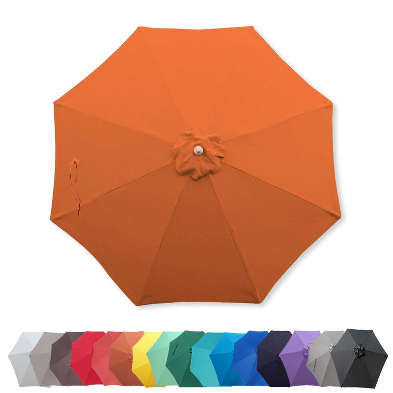 The 9ft Market Patio Umbrella 8 Rib Replacement Canopy in Tangerine from Formosa Covers is open and viewed from above. Below it, there is a lineup of variously colored closed umbrellas, featuring shades of gray, red, pink, yellow, green, blue, purple, and black.