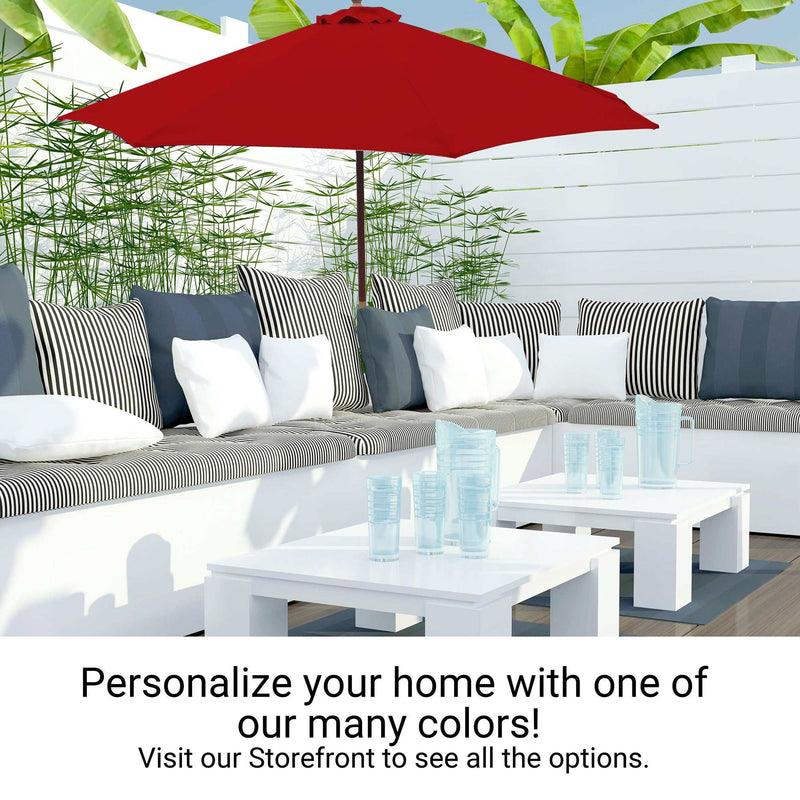 A modern outdoor patio featuring the Formosa Covers 9ft Market Patio Umbrella with an 8 rib replacement canopy in cherry red, a white sectional sofa adorned with black and white striped cushions, and a white coffee table displaying clear glassware. Text on the image reads, "Personalize your home with one of our many colors! Visit our Storefront to see all the options.