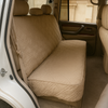 Taupe quilted car seat bench cover for pets, fits most vehicles, protects against dirt and pet hair.