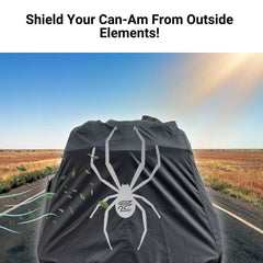 A Can-Am Spyder RS is protected by a Formosa Covers Can-Am Spyder Sport Model Full Cover for RS, ST, ST-S, F3, and F3-S featuring a large spider design. Positioned on an open road with fields on either side and leaves blown by the wind visible around the vehicle, the text above reads, 