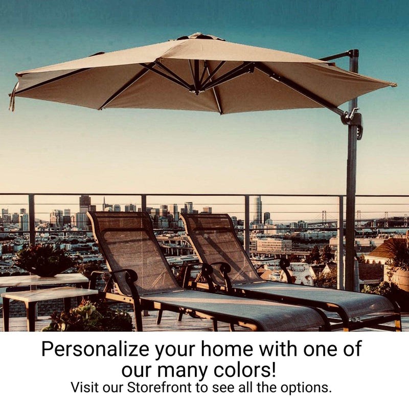 An outdoor deck with two lounge chairs under a large, Formosa Covers 11ft Cantilever Supported Bar Umbrella with an 8 Rib Replacement Canopy in taupe, made from durable polyester fabric, overlooking a cityscape at sunset. Text overlay reads, "Personalize your home with one of our many colors! Visit our Storefront to see all the options.