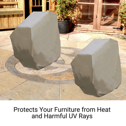 Two covered patio furniture pieces are placed on a stone patio, with wooden doors and greenery in the background. The text below the image reads, "Protects Your Furniture from Heat and Harmful UV Rays with Heavy-Duty Construction. Patio Stacked Chairs Cover Up to 8 Chairs 32"W x 42"D Classic Taupe by Formosa Covers.