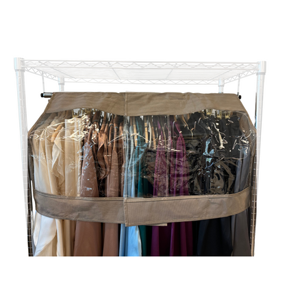 A freestanding garment rack filled with assorted long coats and dresses, protected by a beige-colored Formosa Covers Closet Rod and Portable Clothing Rack Shoulder Garment Dust Cover, adjustable to fit 26" to 48" long, featuring a clear plastic window. The clothing includes various colors such as tan, blue, purple, and darker shades, neatly arranged on hangers for optimal wardrobe protection.