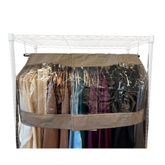 A freestanding garment rack filled with assorted long coats and dresses, protected by a beige-colored Formosa Covers Closet Rod and Portable Clothing Rack Shoulder Garment Dust Cover, adjustable to fit 26