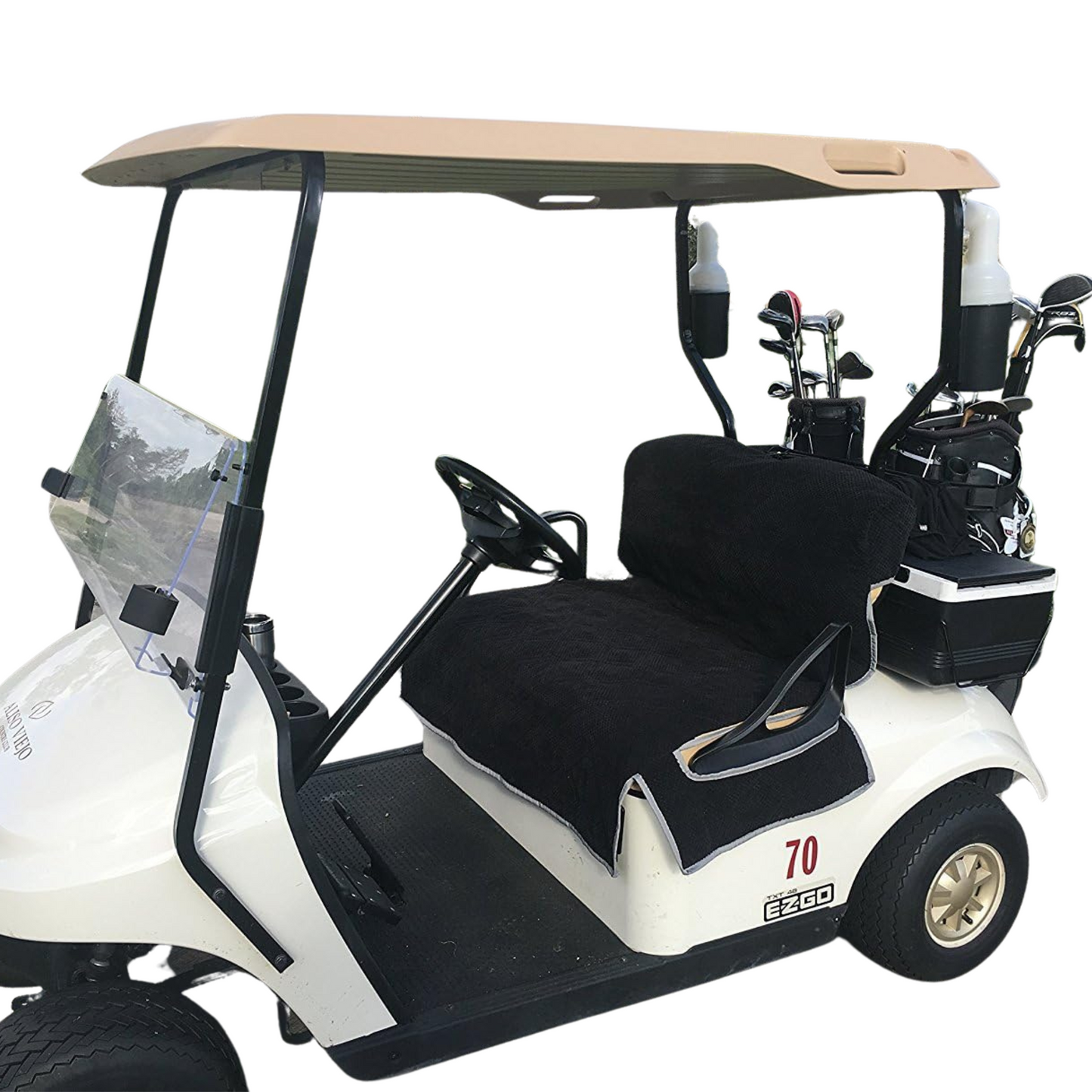 A well-maintained white golf cart featuring comfortable accessories, including a beige roof and clear windshield. It has two black cushioned seats with the Reversible Golf Cart Dual Seat Blanket Cover in black and taupe from Formosa Covers. The cart also includes a steering wheel, golf clubs stored in the back, and the number "70" printed on the side.