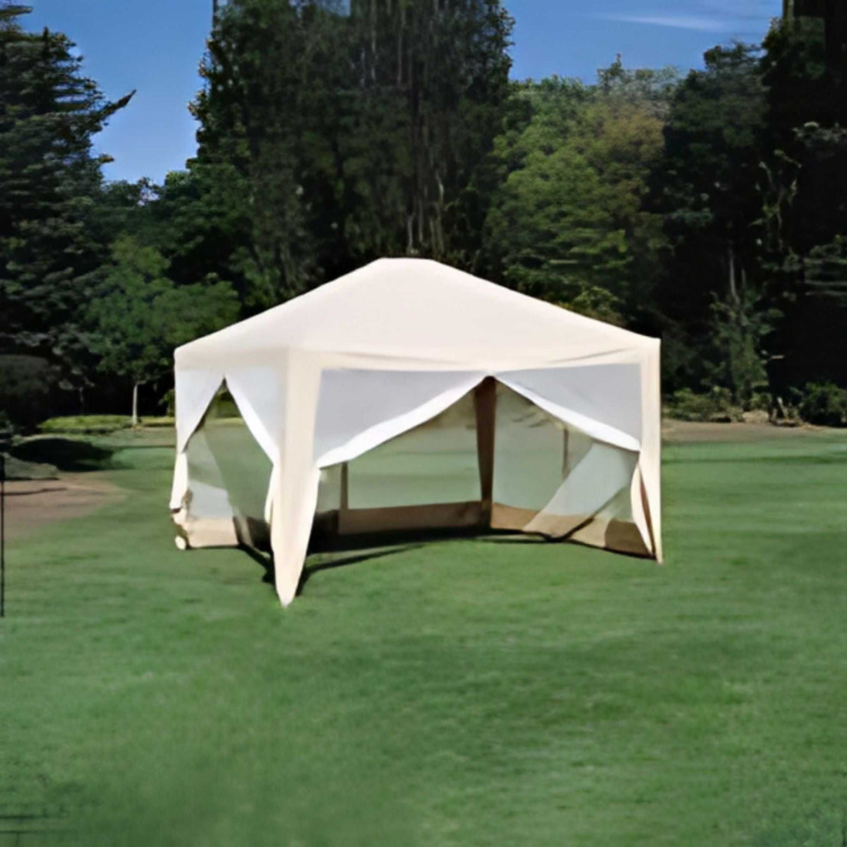 A beige, hexagonal outdoor canopy made from 300 Denier polyester fabric by Formosa Covers stands on a well-manicured lawn. The 12ft x 10ft Screen House Replacement Fabric Skin features mesh sides and is surrounded by lush greenery and trees in the background, under a clear blue sky.