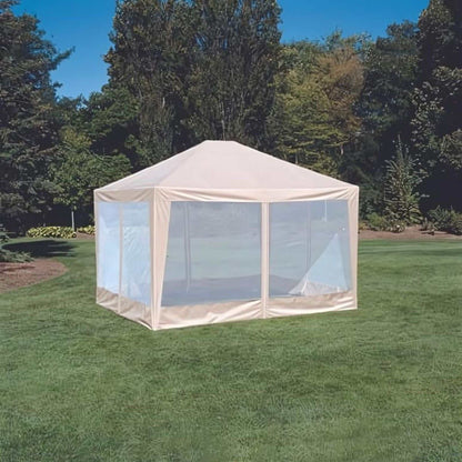 A 12ft x 10ft Screen House Replacement Fabric Skin in Beige by Formosa Covers is set up on a lush green lawn, surrounded by trees. The clear blue sky above indicates it is a sunny day.