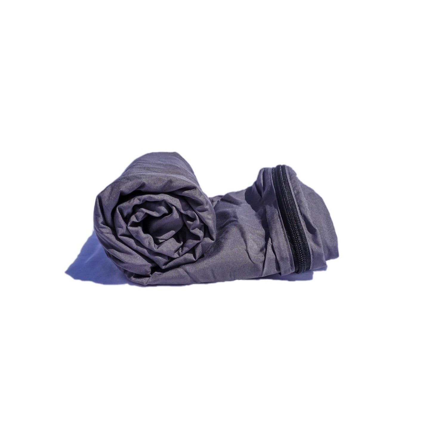 A neatly rolled up Formosa Covers Sleeping Bag Liner, designed for hiking, camping, hostels, and travel. Its gray rectangular shape features a visible black zipper running along its 80" length. Placed on a white surface, the lightweight fabric makes it look compact and ideal as a portable sleeping bag liner.