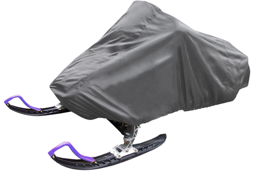 A parked snowmobile is covered with the Formosa Covers Snowmobile Storage Cover Fit Up Length 105"-125", a protective, semi-custom fit gray tarp. The front skis, which are purple and black, are visible sticking out from underneath the cover.
