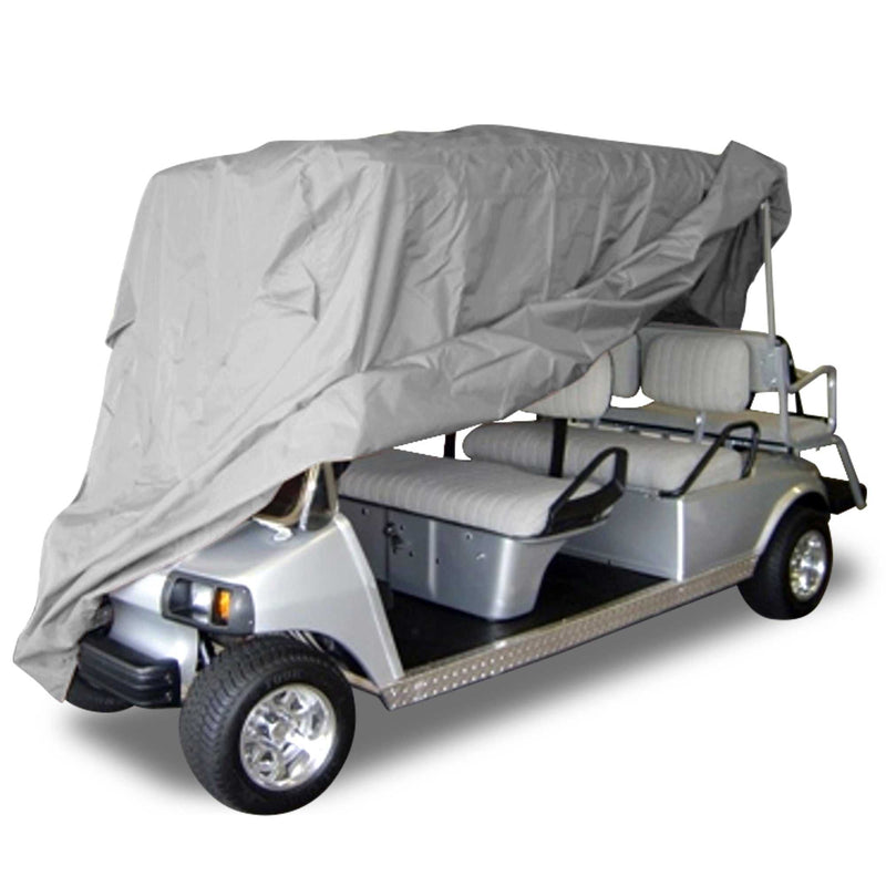 A silver golf cart with a four-seat configuration is partially covered by a Formosa Covers 6 Passenger Golf Cart Storage Cover in Grey, which is draped over the top and sides but not fully secured. The golf cart has a windshield and chrome wheels, and the seats are padded with white cushioning.